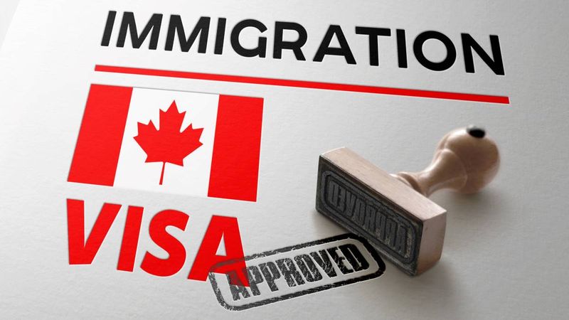 Canada-Visa-Approved-with-Rubber-Stamp-and-Canadian-flag |  how to apply for a Canada visa from the Philippines