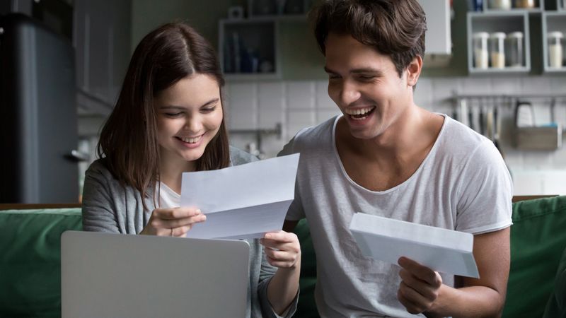 two-students-happily-looking-over-a-document-mcgill-university