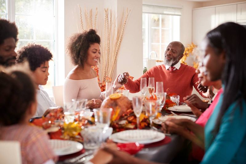 African family celebrating thanksgiving at the dinner table | how to apply for a Canada visa from the Democratic Republic of Congo