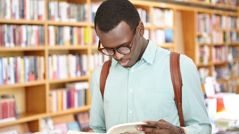 male-student-in-library-how-to-move-to-canada-from-ghana