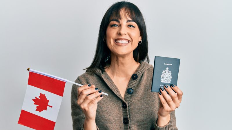 canada-immigrants-woman-happy-with-passport