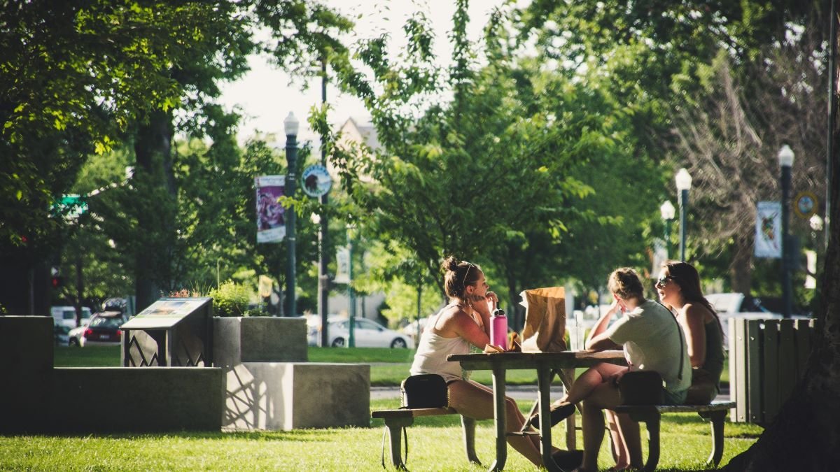 woman-sitting-in-park-best-cities-to-live-and-work-in-canada